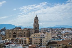 Panoramic view to the city and Cathedral of Malaga with a mountainous background