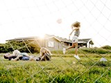 A family playing football in a Danish holiday home
