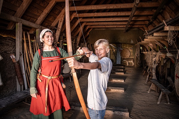 A child experiences archery like a true Viking in Bork Vikingehavn