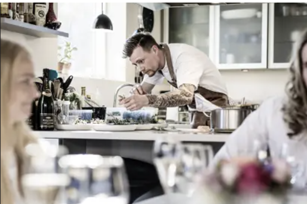 A private chef is cooking for a celebration in the holiday home
