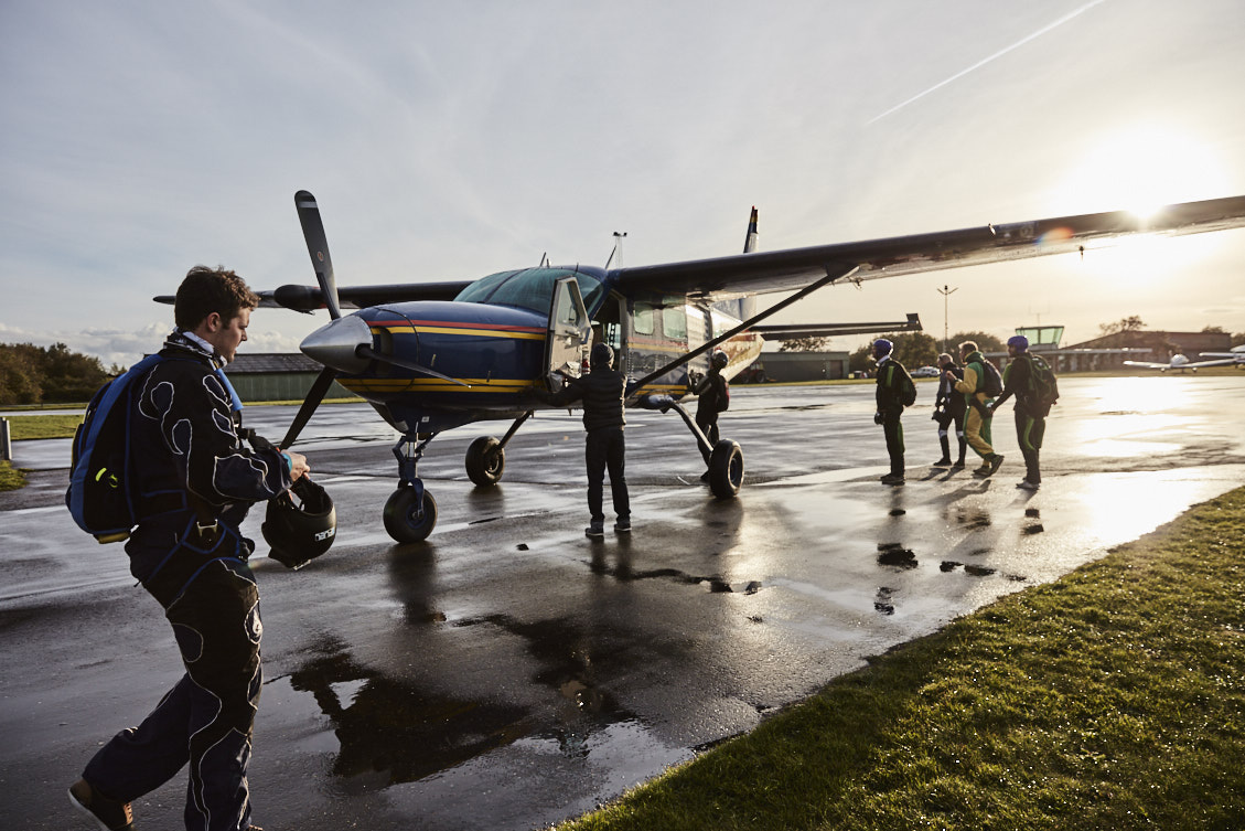 A small airplane and parachutists