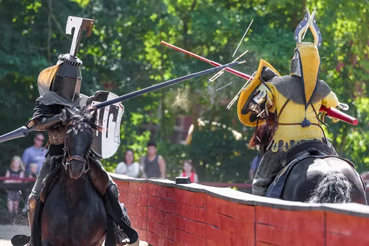 Two knights on horseback fighting each other