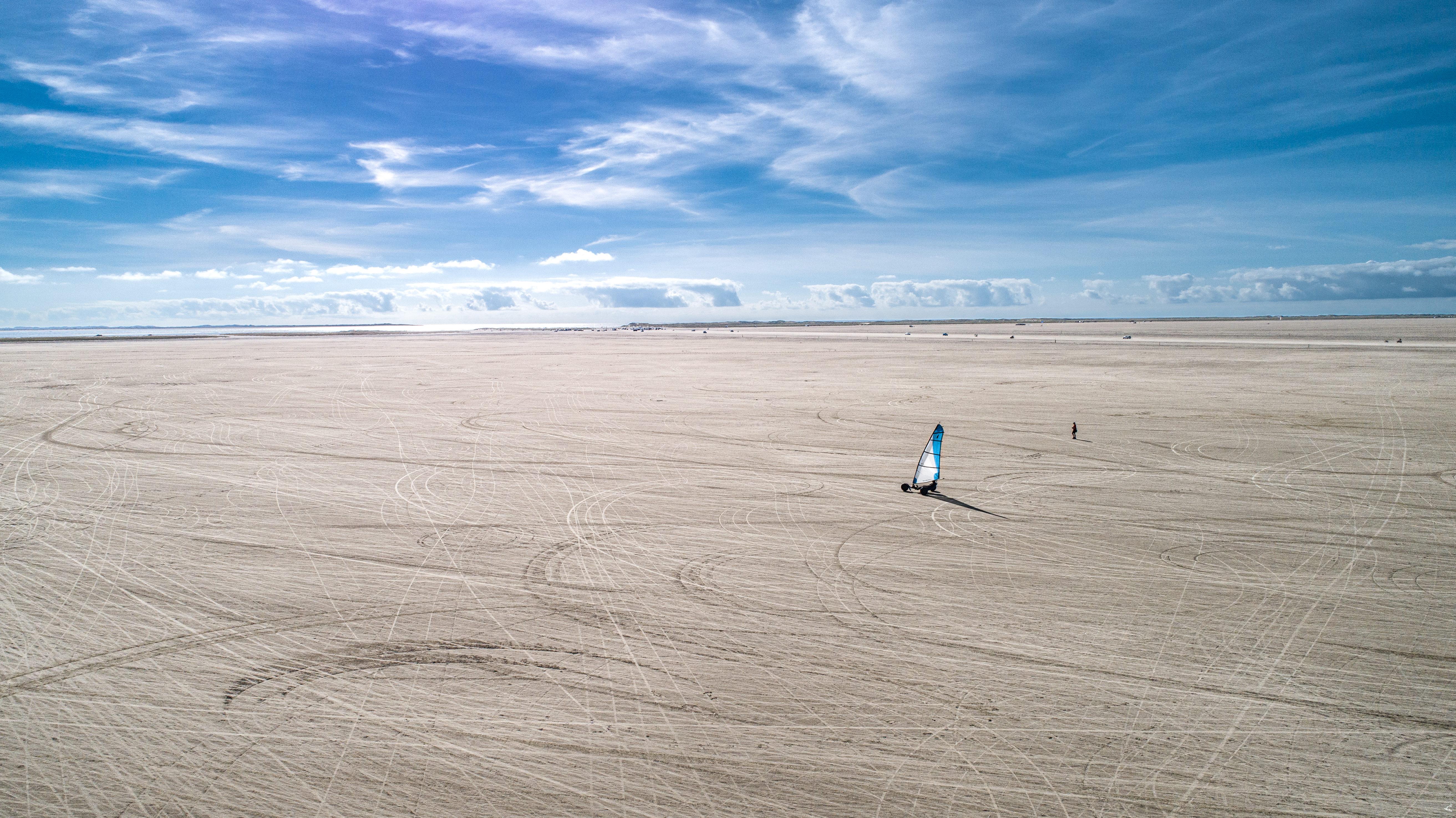 Beach surfer towards open spaces on Rømø