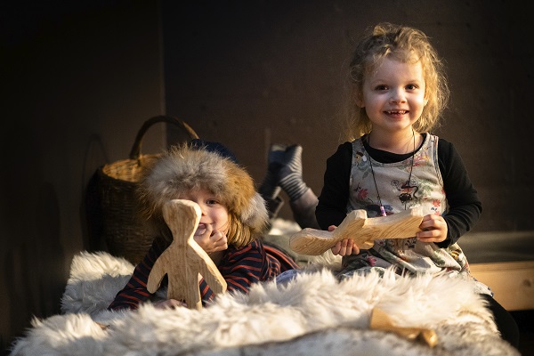 Two children are sitting in the children’s area of the Viking Ship Museum in Roskilde