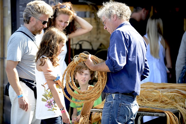 A man explains the ropes to a family in the rope store