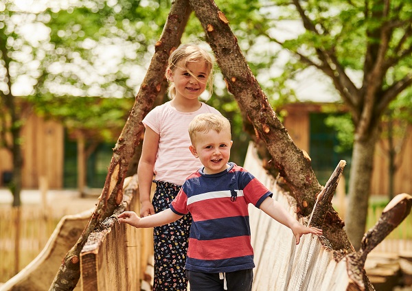 Two small children playing in WOW PARK